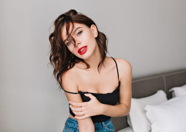 portrait-attractive-girl-with-naked-shoulders-chilling-modern-apartment-fashionable-brunette-young-model-red-lips-relaxing-time-fashion-scaled.jpg